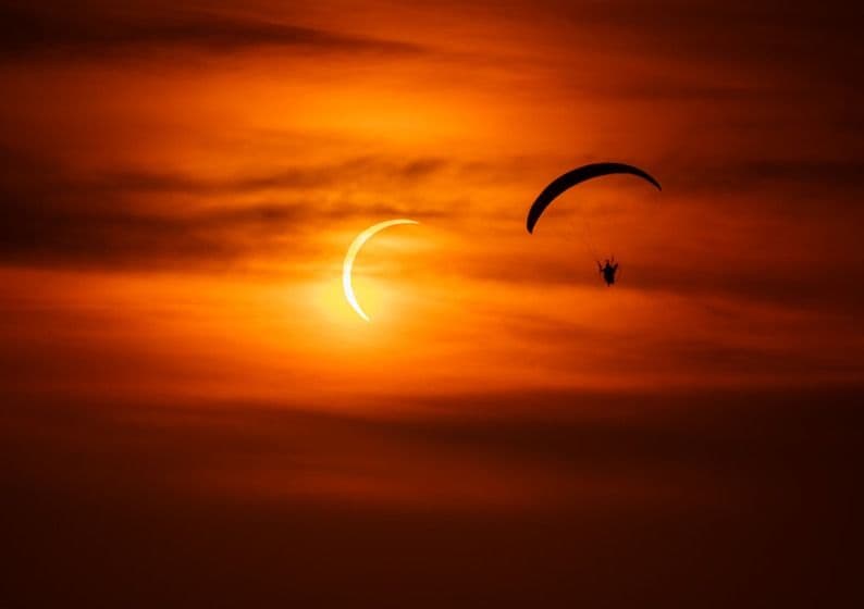 Horacio Llorens flies during Mallorca's total solar eclipse
